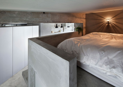 Bare concrete apartment by Airhouse Design Office presents its own fashion exhibitions