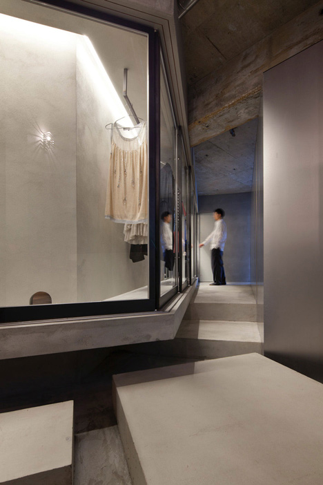 Bare concrete apartment by Airhouse Design Office presents its own fashion exhibitions