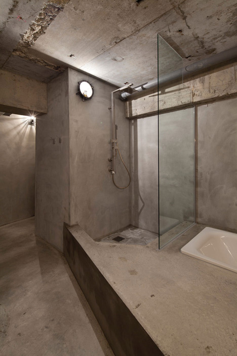 Bare concrete apartment by Airhouse Design Office presents its own fashion exhibitions