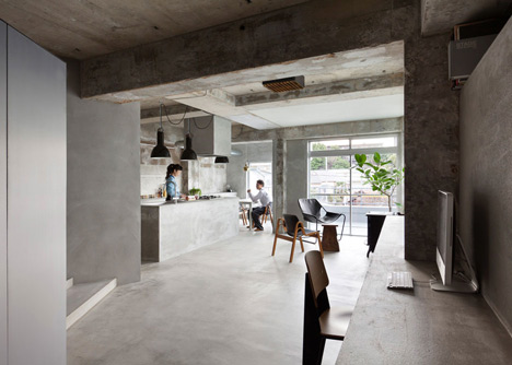 Bare concrete apartment by Airhouse Design Office presents its own fashion exhibitions
