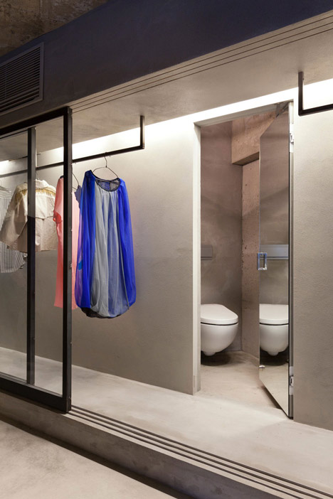 Bare concrete apartment by Airhouse Design Office presents its own fashion exhibitions