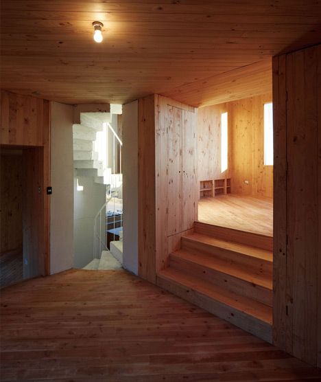 Concrete staircase spirals up through Pezo von Ellrichshausens Casa Gago