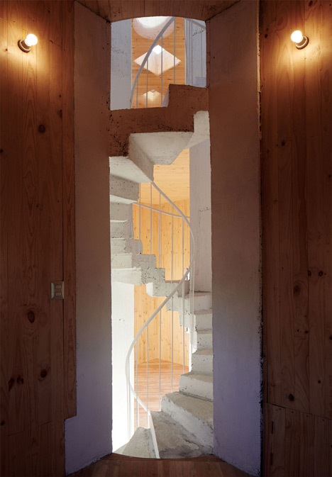 Concrete staircase spirals up through Pezo von Ellrichshausens Casa Gago