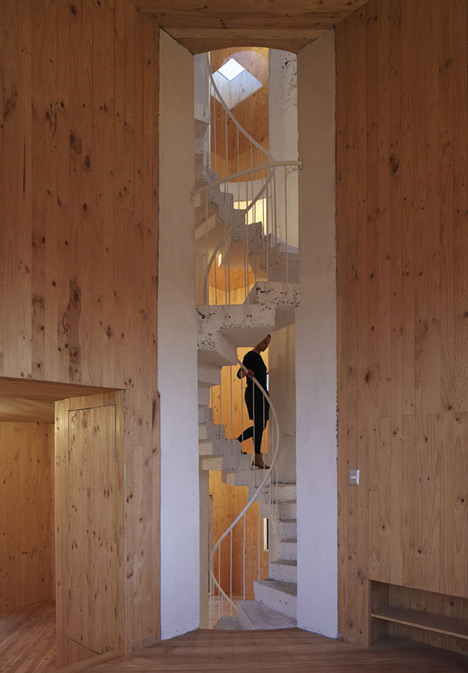 Concrete staircase spirals up through Pezo von Ellrichshausens Casa Gago