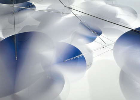 Moving plastic petals balanced in Interconnection installation by Nao Tamura
