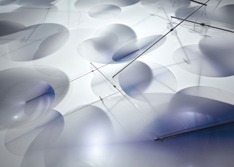 Moving plastic petals balanced in Interconnection installation by Nao Tamura