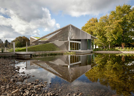 Water treatment facility by Skylab Architecture features a roof of grass-covered fins