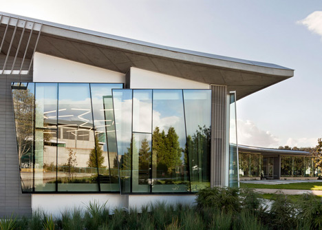 Water treatment facility by Skylab Architecture features a roof of grass-covered fins
