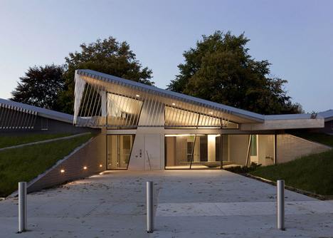 Water treatment facility by Skylab Architecture features a roof of grass-covered fins
