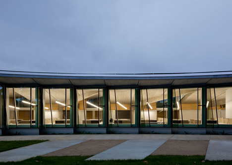 Water treatment facility by Skylab Architecture features a roof of grass-covered fins