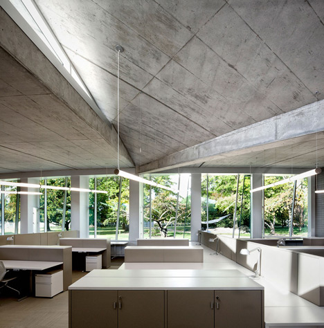 Water treatment facility by Skylab Architecture features a roof of grass-covered fins