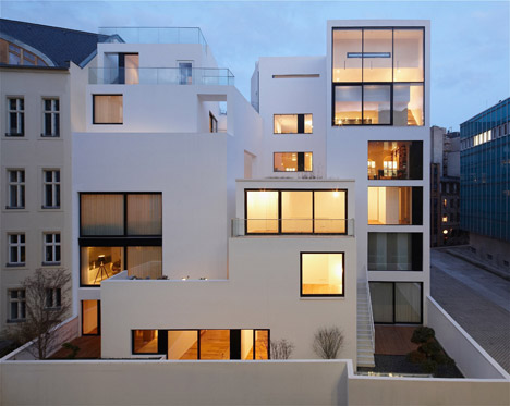 Balconies sit within angular openings at Atelier Zafari's Berlin apartment block