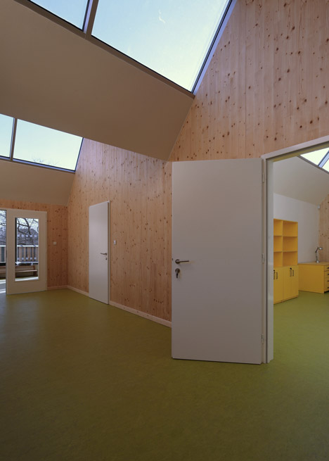 3+1 Architekti converts a stone barn into a woodwork facility with a serrated timber extension