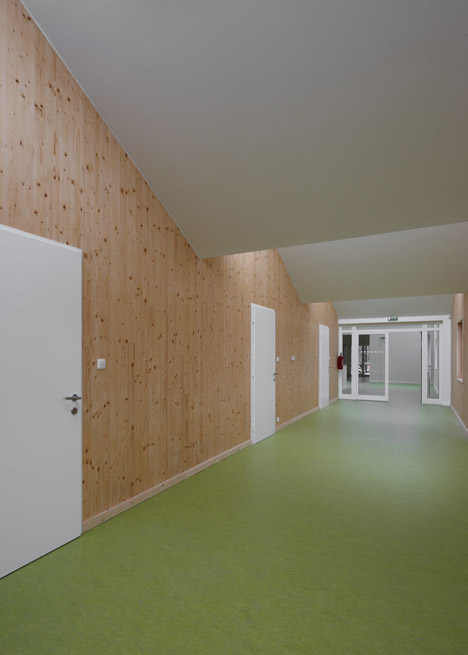 3+1 Architekti converts a stone barn into a woodwork facility with a serrated timber extension