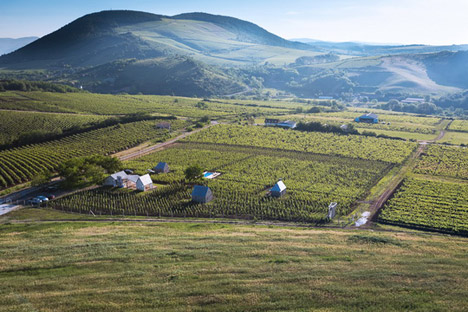 Earthy cabins hide amongst the vineyards<br /> at the Almagyar Wine Terrace in Hungary by by Péter Gereben and Balázs Marián