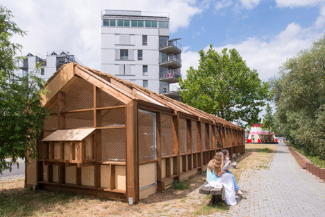 Guinée*Potin Architectes creates "footcheball" playground inside a thatched shed