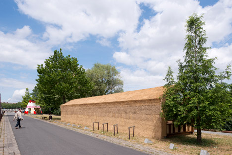 Guinée*Potin Architectes creates "footcheball" playground inside a thatched shed