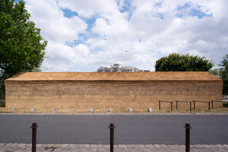 Guinée*Potin Architectes creates "footcheball" playground inside a thatched shed