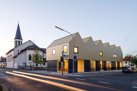 netzwerkarchitekten completes German community centre with metal-clad zigzagging roof