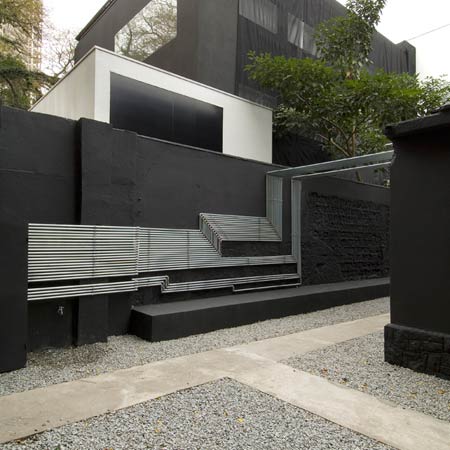 Pipe Light is an installation on an abandoned house in São Paulo, Brazil by French-Brazilian architects Triptyque