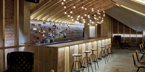 Bar in an attic space in Minsk by Inblum Architects