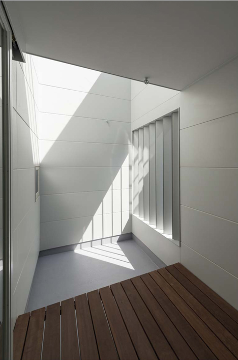 Japanese house designed around a dining table by Tsubasa Iwahashi Architects