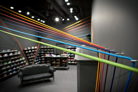 Run Colors trainers store by Modelina Architekci