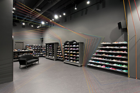 Run Colors trainers store by Modelina Architekci