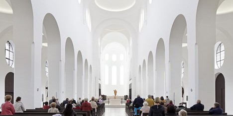 John Pawson's minimal St Moritz Church photographed during a choir rehearsal