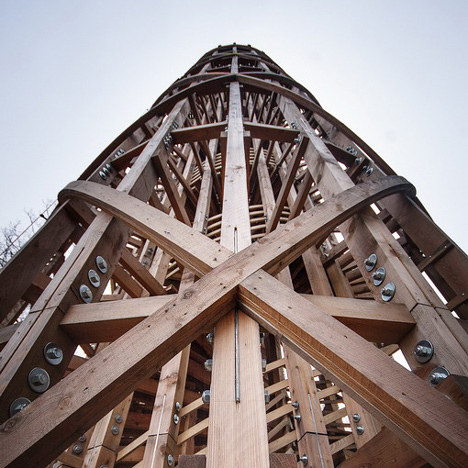 Timber observation tower shaped like a cucumber by Mjölk Architekti