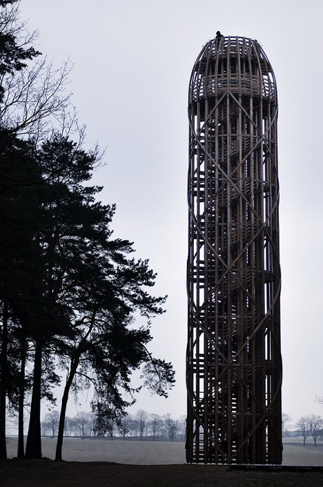 Timber observation tower shaped like a cucumber by Mjölk Architekti