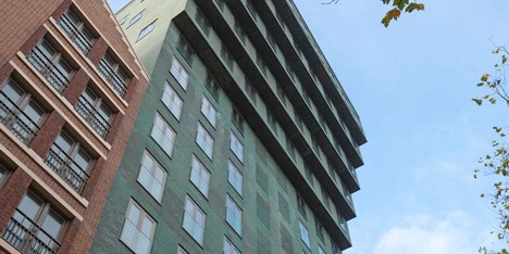 Turquoise tower by NL Architects that staggers back to create sunny balconies