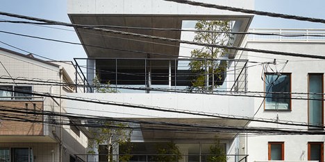 Four-storey house with tree-lined balconies by Ryo Matsui Architects