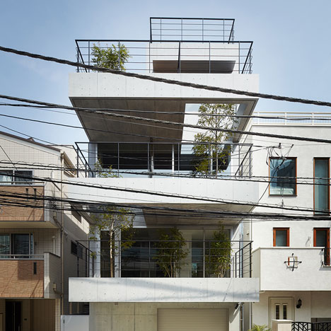 Four-storey house with tree-lined balconies by Ryo Matsui Architects