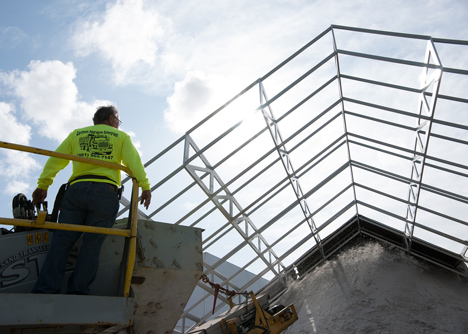 Roof over a pile of sand forms entrance to Design Miami 2013