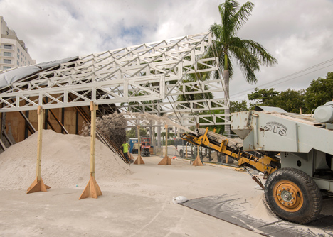 Roof over a pile of sand forms entrance to Design Miami 2013
