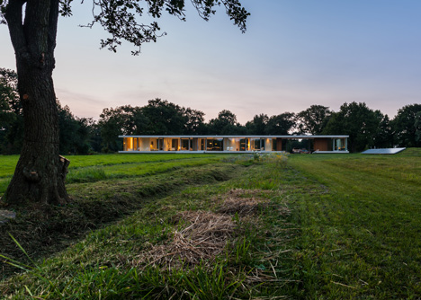 Dutch studio Inbo hides a transparent house behind a grove of trees