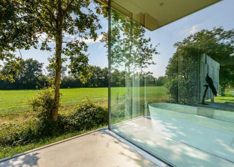 Dutch studio Inbo hides a transparent house behind a grove of trees