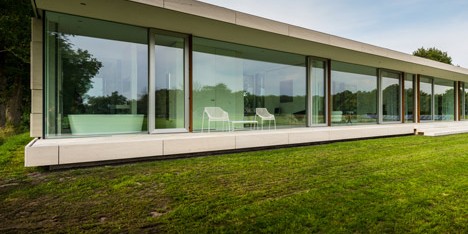 Dutch studio Inbo hides a transparent house behind a grove of trees