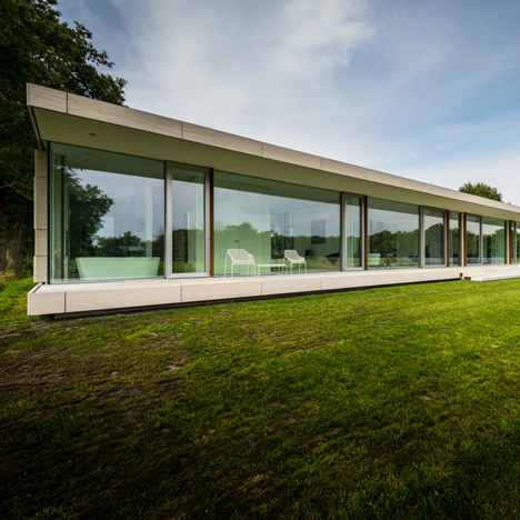 Dutch studio Inbo hides a transparent house behind a grove of trees