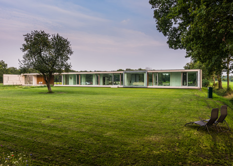 Dutch studio Inbo hides a transparent house behind a grove of trees