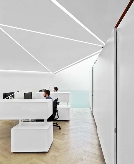 Great James Street Office extension with a faceted copper roof by Emrys Architects