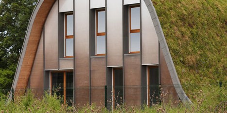 Hump-shaped house blanketed by plants by Patrick Nadeau