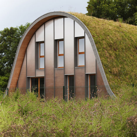 Hump-shaped house blanketed by plants by Patrick Nadeau