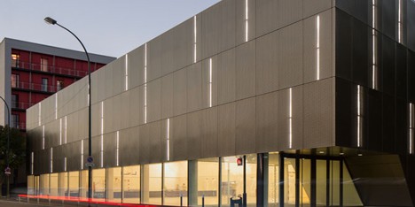 Parisian sports hall by Ateliers O-S Architectes with bands of light on its walls