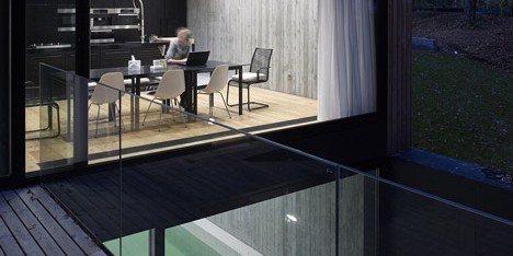 Timber-clad seaside house with a grainy concrete interior by Ultra Architects