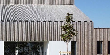 Timber-clad kindergarten in France by Topos Architecture