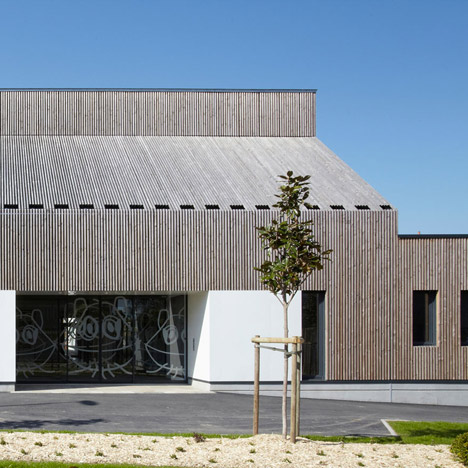 Timber-clad kindergarten in France by Topos Architecture