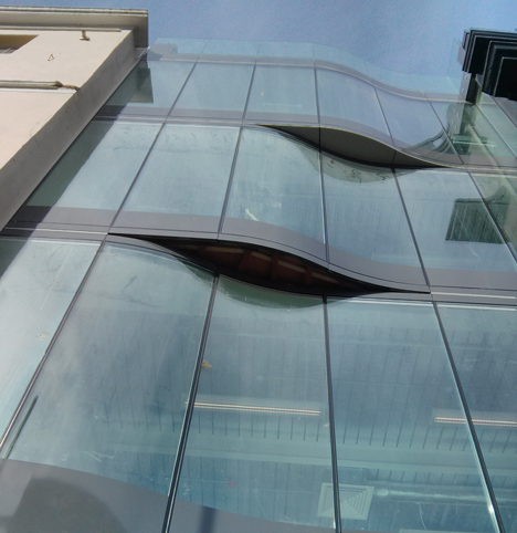 The Workshop offices by Guy Hollaway Architects feature a tubular steel slide
