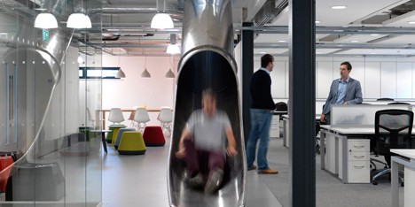 The Workshop offices with a slide through the centre by Guy Holloway